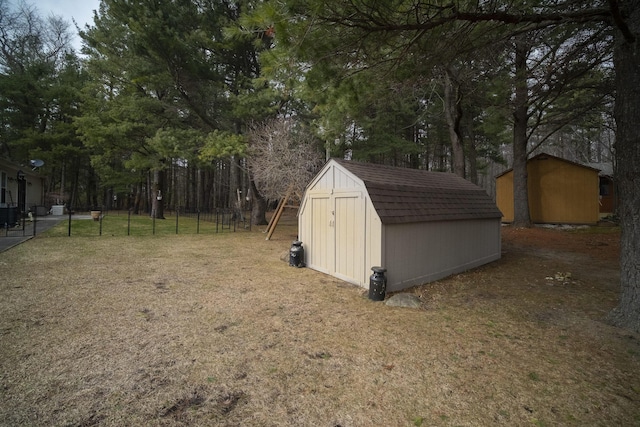 9155 Ivanhoe Dr, Onekama, MI 49675 - view of shed with fence