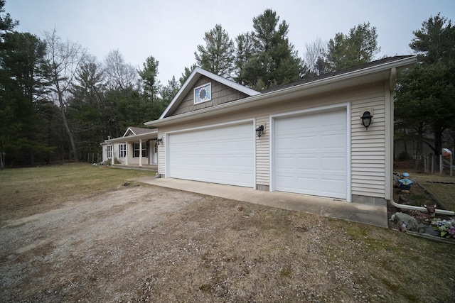 9155 Ivanhoe Dr, Onekama, MI 49675 - garage with driveway
