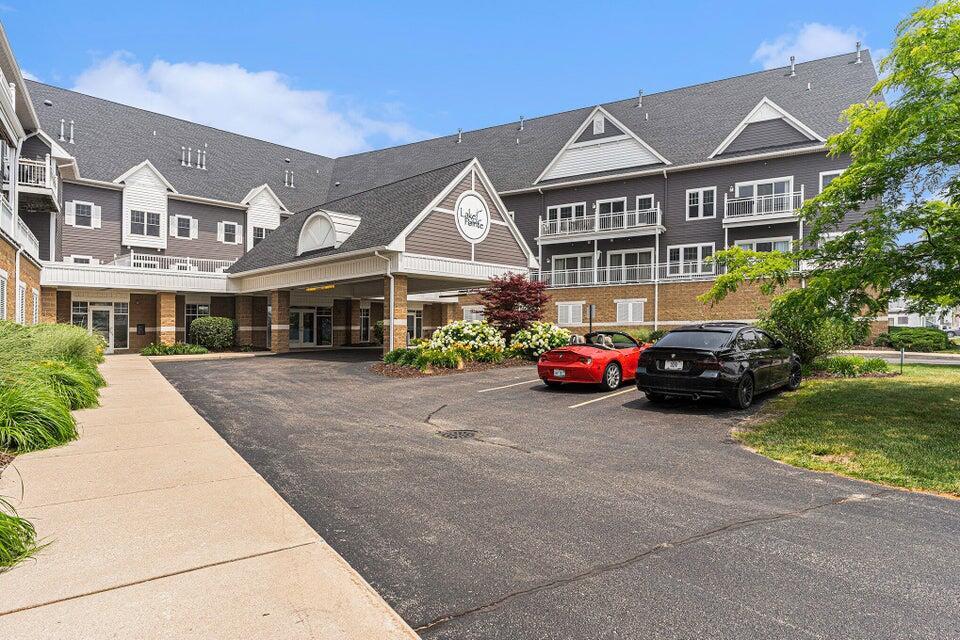 view of property with uncovered parking