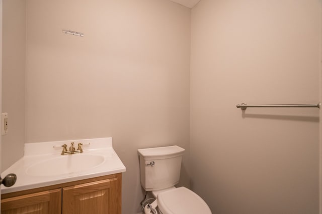 bathroom with toilet and vanity