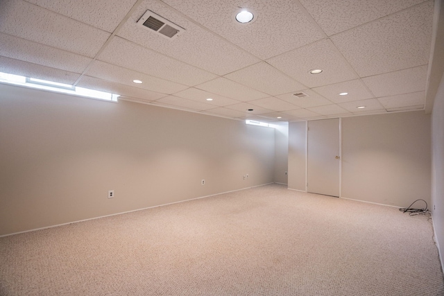 spare room with light colored carpet, a paneled ceiling, visible vents, and recessed lighting