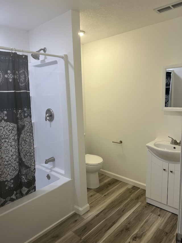 1314 Alexandrine St, Mount Morris, MI 48458 - full bath with wood finished floors, vanity, and shower / bath combo