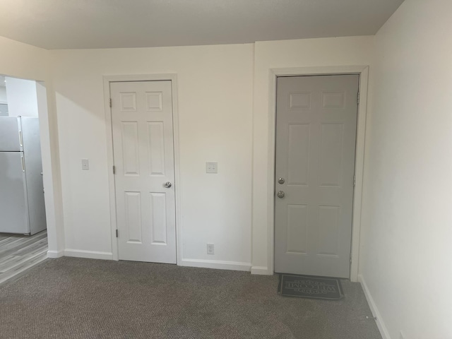 1314 Alexandrine St, Mount Morris, MI 48458 - foyer entrance featuring baseboards and carpet flooring
