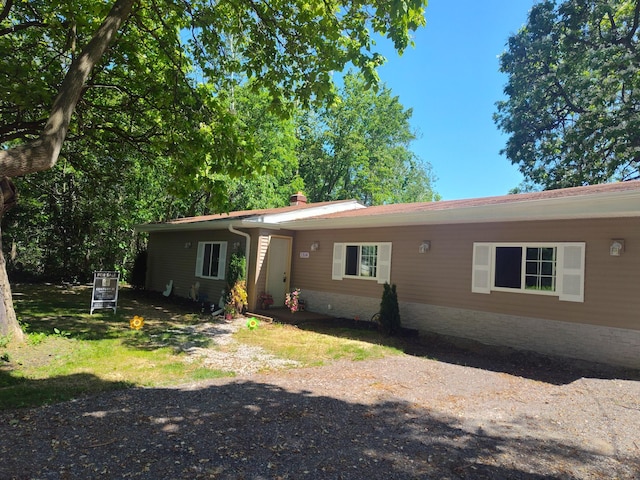 1314 Alexandrine St, Mount Morris, MI 48458 - ranch-style home featuring a chimney