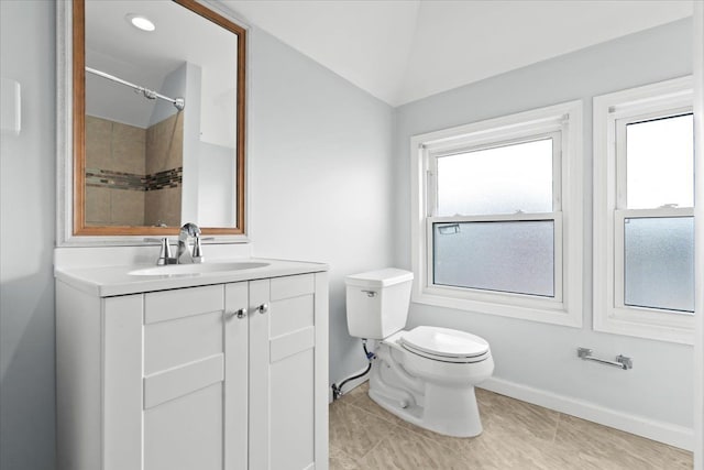 bathroom with vanity, baseboards, tile patterned floors, and toilet