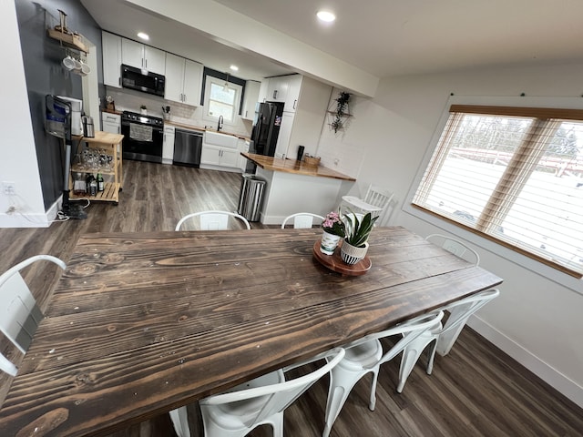 dining area with recessed lighting, wood finished floors, and baseboards