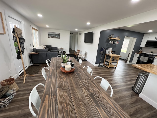 dining area with baseboards, dark wood-style flooring, visible vents, and recessed lighting