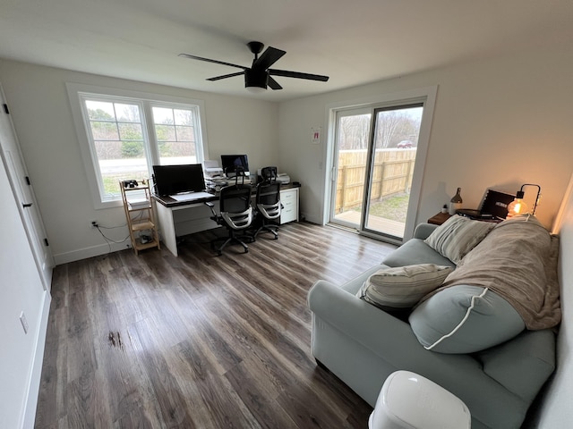 home office featuring baseboards, a ceiling fan, and dark wood-style floors