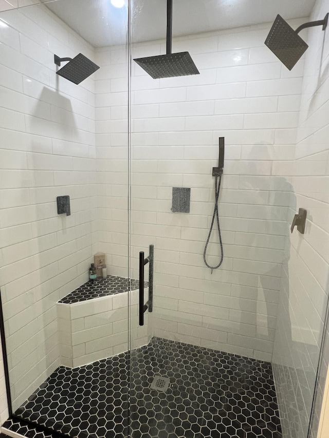 full bath featuring tile patterned floors and a stall shower