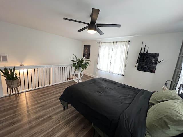 bedroom with visible vents, wood finished floors, and ceiling fan