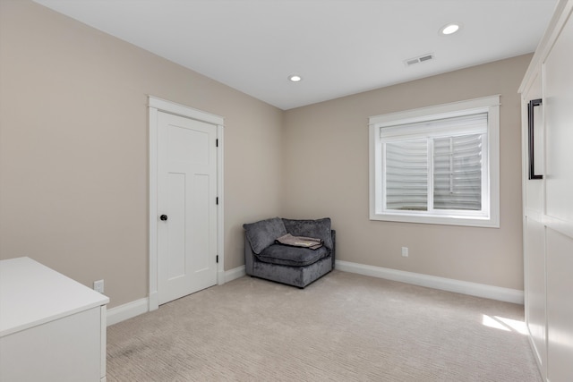 unfurnished room featuring baseboards, visible vents, light carpet, and recessed lighting