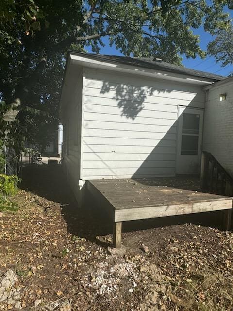 view of home's exterior with a wooden deck