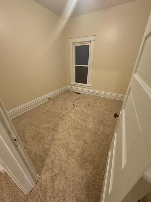 interior space with baseboards and visible vents