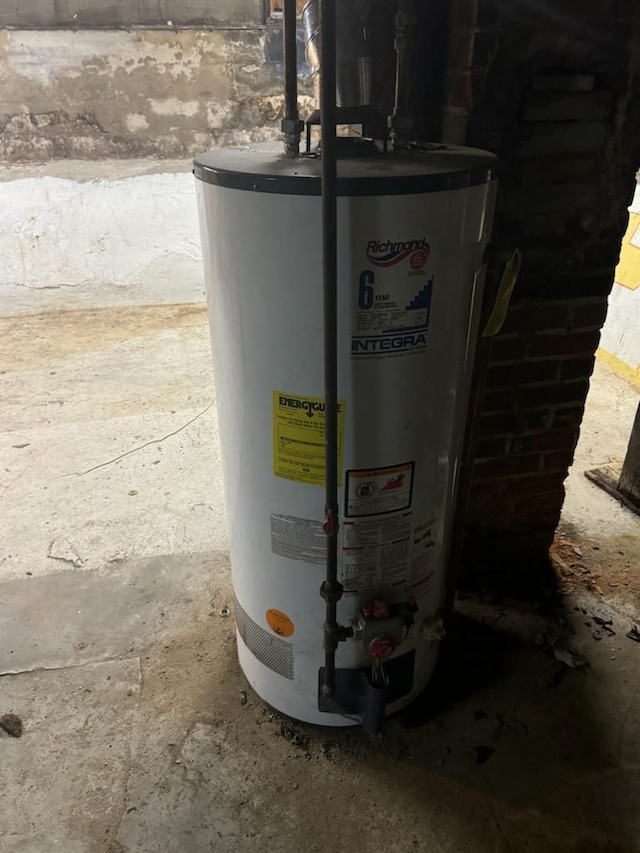 utility room featuring gas water heater