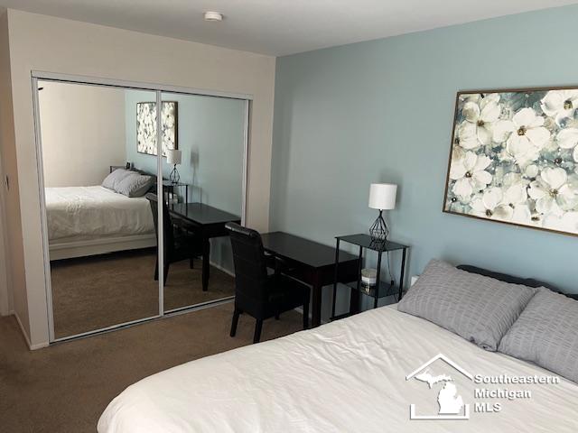 bedroom featuring carpet floors and a closet