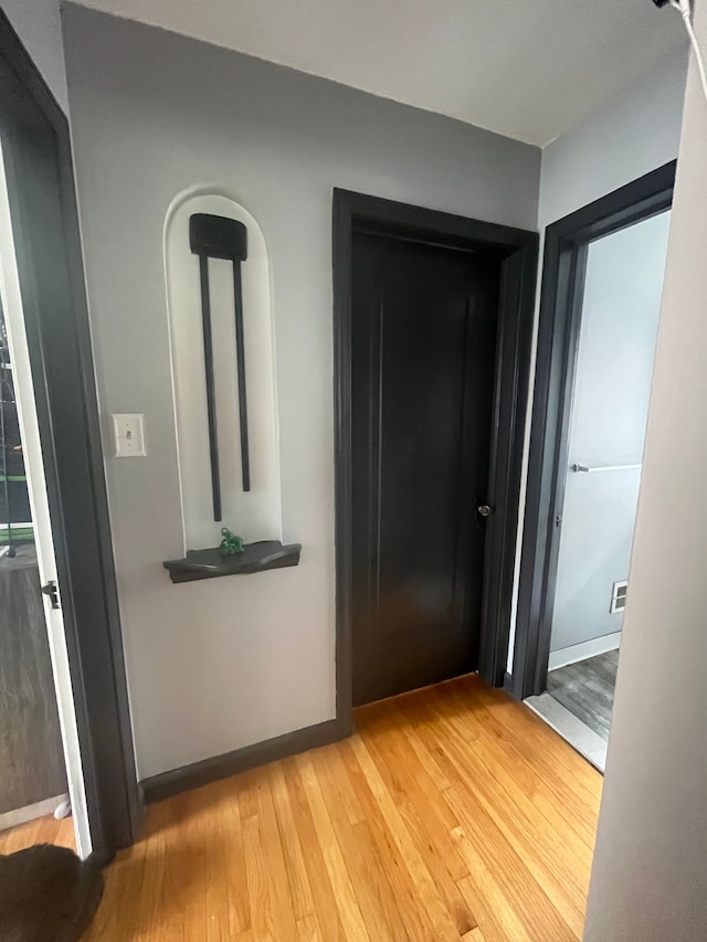 hallway featuring light wood-style floors