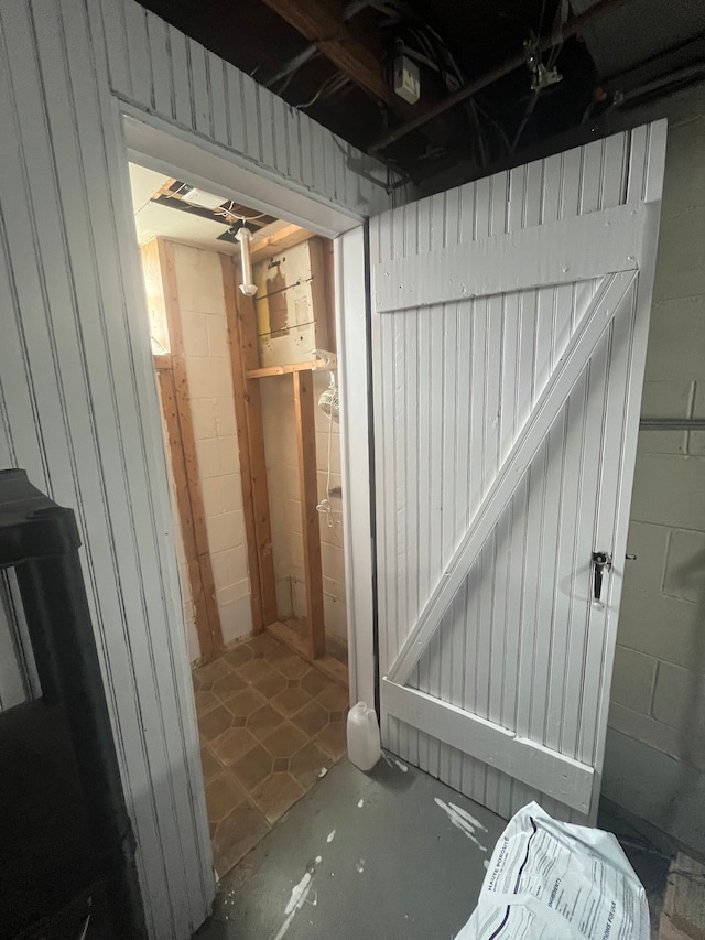 unfinished below grade area with concrete block wall