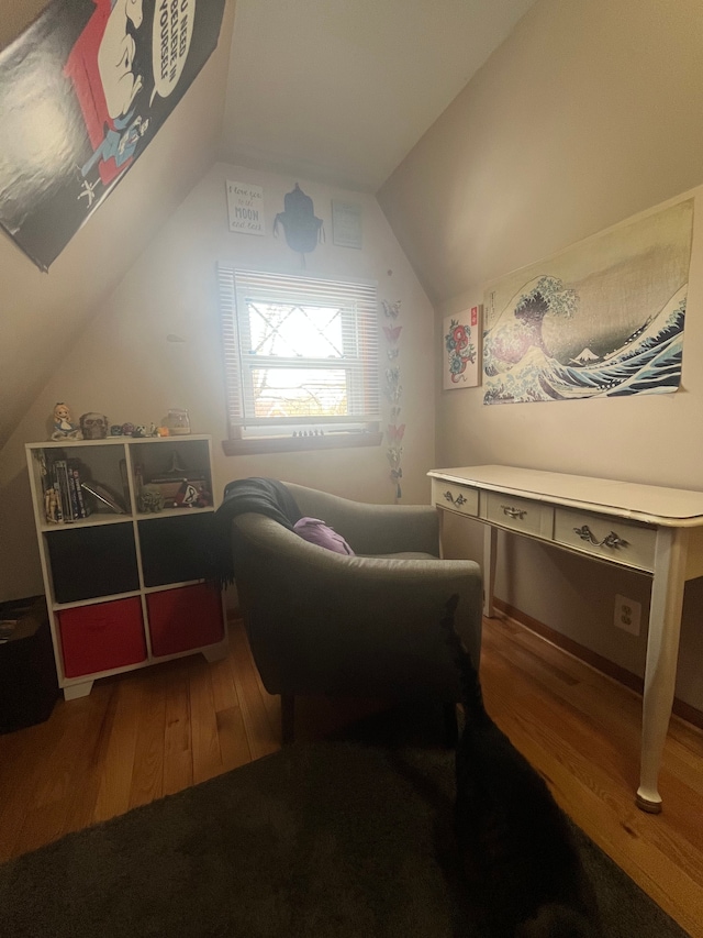 additional living space with lofted ceiling and wood finished floors