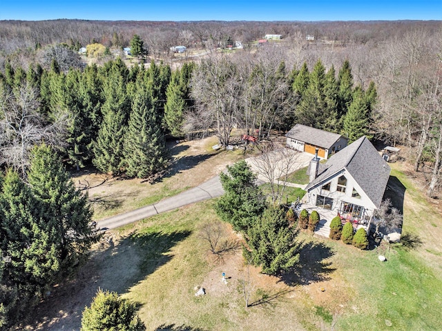 birds eye view of property with a forest view
