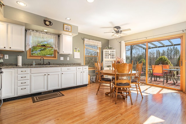 dining space with recessed lighting, light wood-style flooring, and ceiling fan