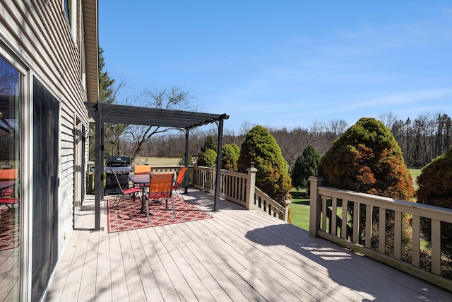 wooden deck with outdoor dining area