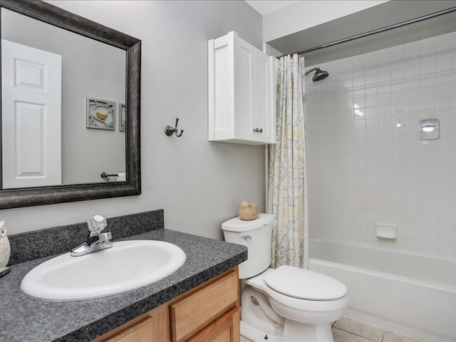 bathroom with vanity, tile patterned floors, shower / bath combination with curtain, and toilet
