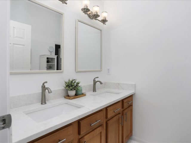 full bathroom with double vanity and a sink