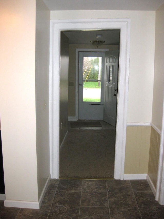 corridor featuring baseboards