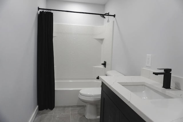 bathroom with tile patterned floors, washtub / shower combination, vanity, and toilet