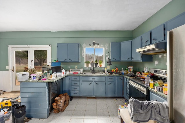 kitchen featuring light floors, under cabinet range hood, a sink, and appliances with stainless steel finishes