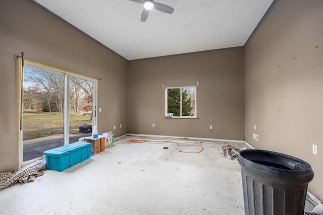unfurnished room featuring baseboards and ceiling fan