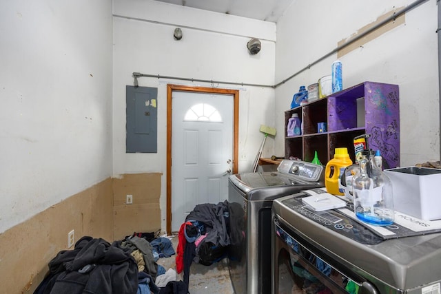washroom with electric panel, laundry area, and independent washer and dryer
