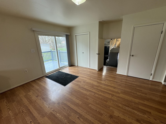 8066 Talladay Rd, Whittaker, MI 48190 - interior space featuring attic access, wood finished floors, baseboards, and access to outside
