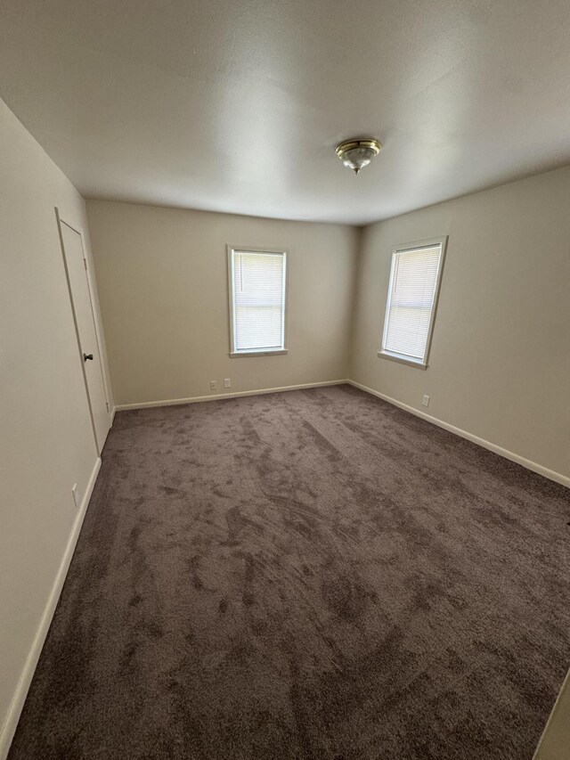 8066 Talladay Rd, Whittaker, MI 48190 - carpeted spare room featuring a healthy amount of sunlight and baseboards