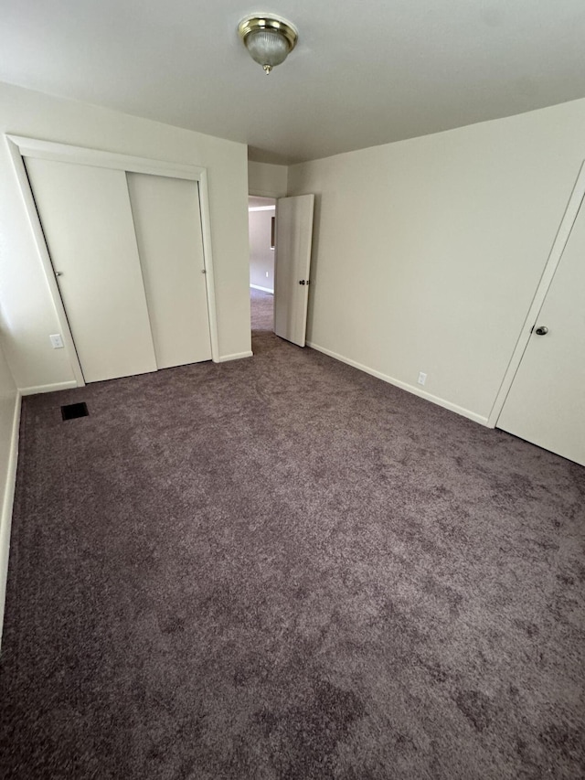 8066 Talladay Rd, Whittaker, MI 48190 - unfurnished bedroom with carpet flooring, visible vents, and a closet