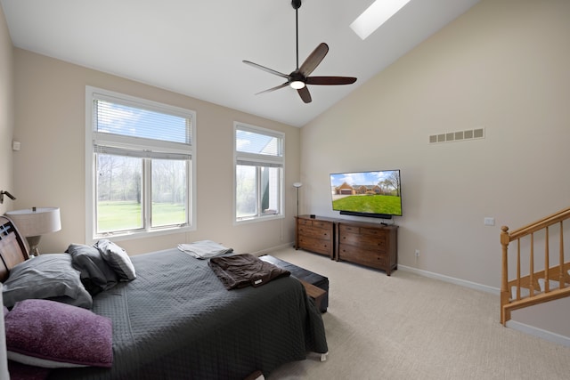 bedroom featuring visible vents, baseboards, carpet floors, a ceiling fan, and high vaulted ceiling