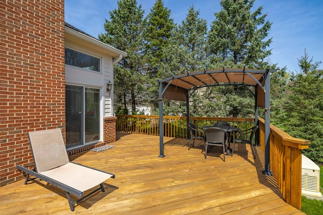 wooden terrace featuring a pergola and outdoor dining area