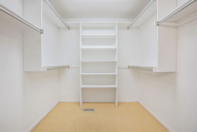 walk in closet featuring carpet floors and visible vents
