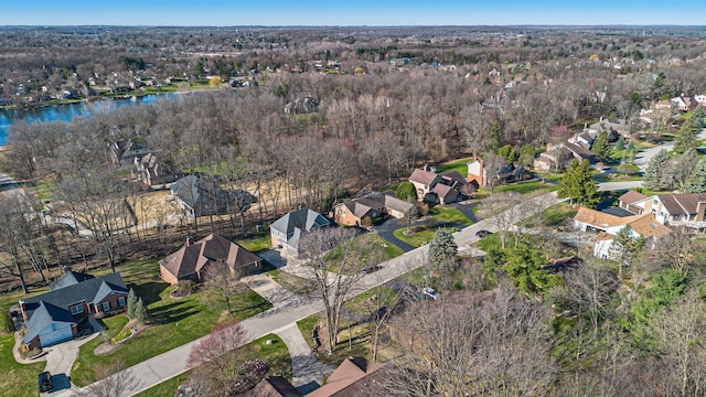 birds eye view of property featuring a residential view and a water view