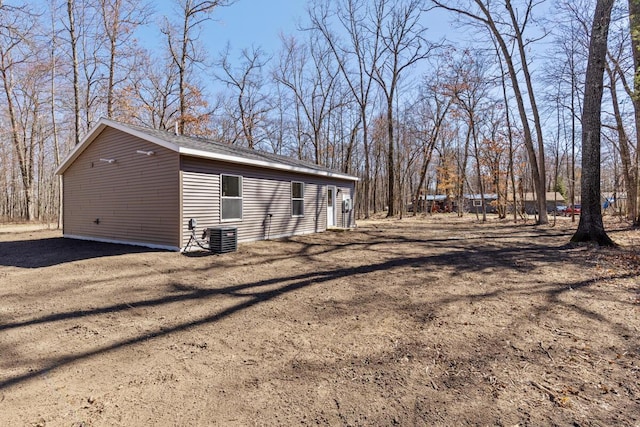 8995 Chippewa Trl, Howard City, MI 49329 - view of side of home with cooling unit