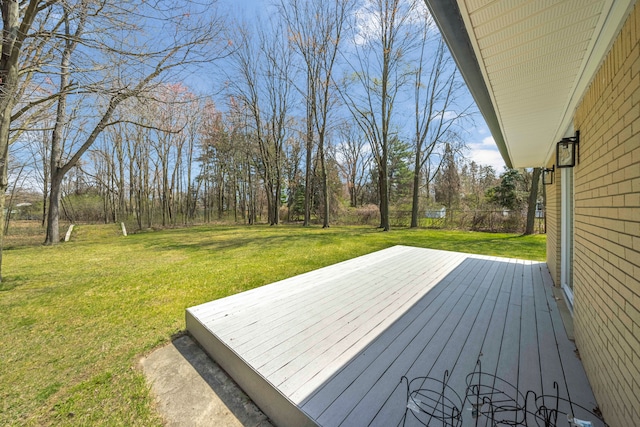 wooden deck with a yard