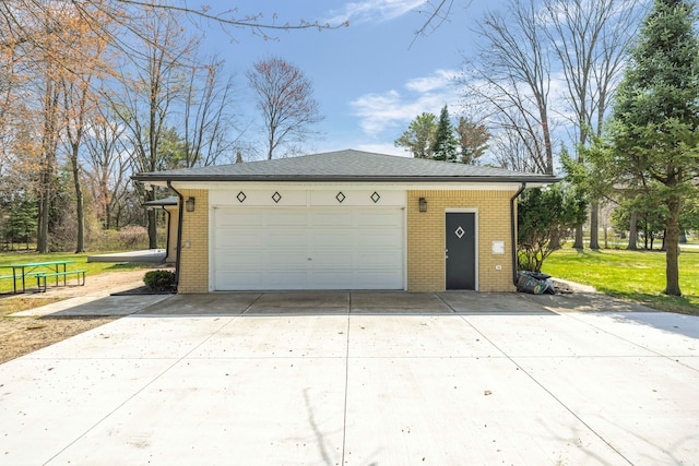 garage with concrete driveway