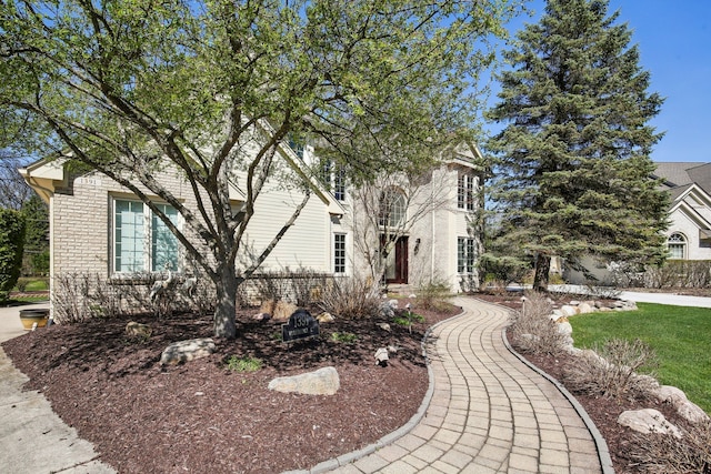 view of front of house with brick siding