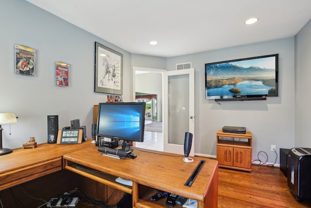 office area with recessed lighting, visible vents, and wood finished floors