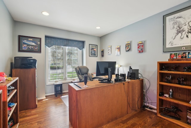 office space featuring recessed lighting, baseboards, and wood finished floors