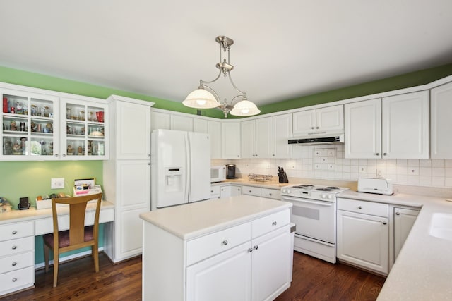 kitchen featuring dark wood-style flooring, under cabinet range hood, white appliances, and white cabinetry