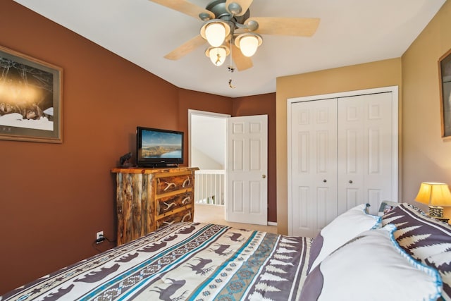 bedroom with carpet floors, a ceiling fan, and a closet