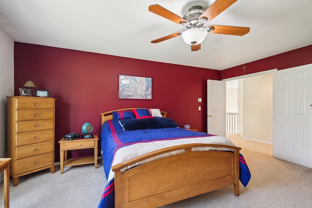 bedroom with a ceiling fan and carpet flooring