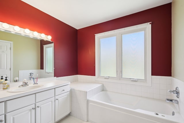 full bath featuring vanity and a garden tub
