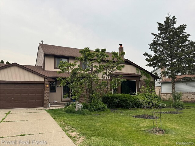 30362 Southampton Ln, Farmington Hills, MI 48331 - view of front of house with a front lawn, a chimney, a garage, and brick siding